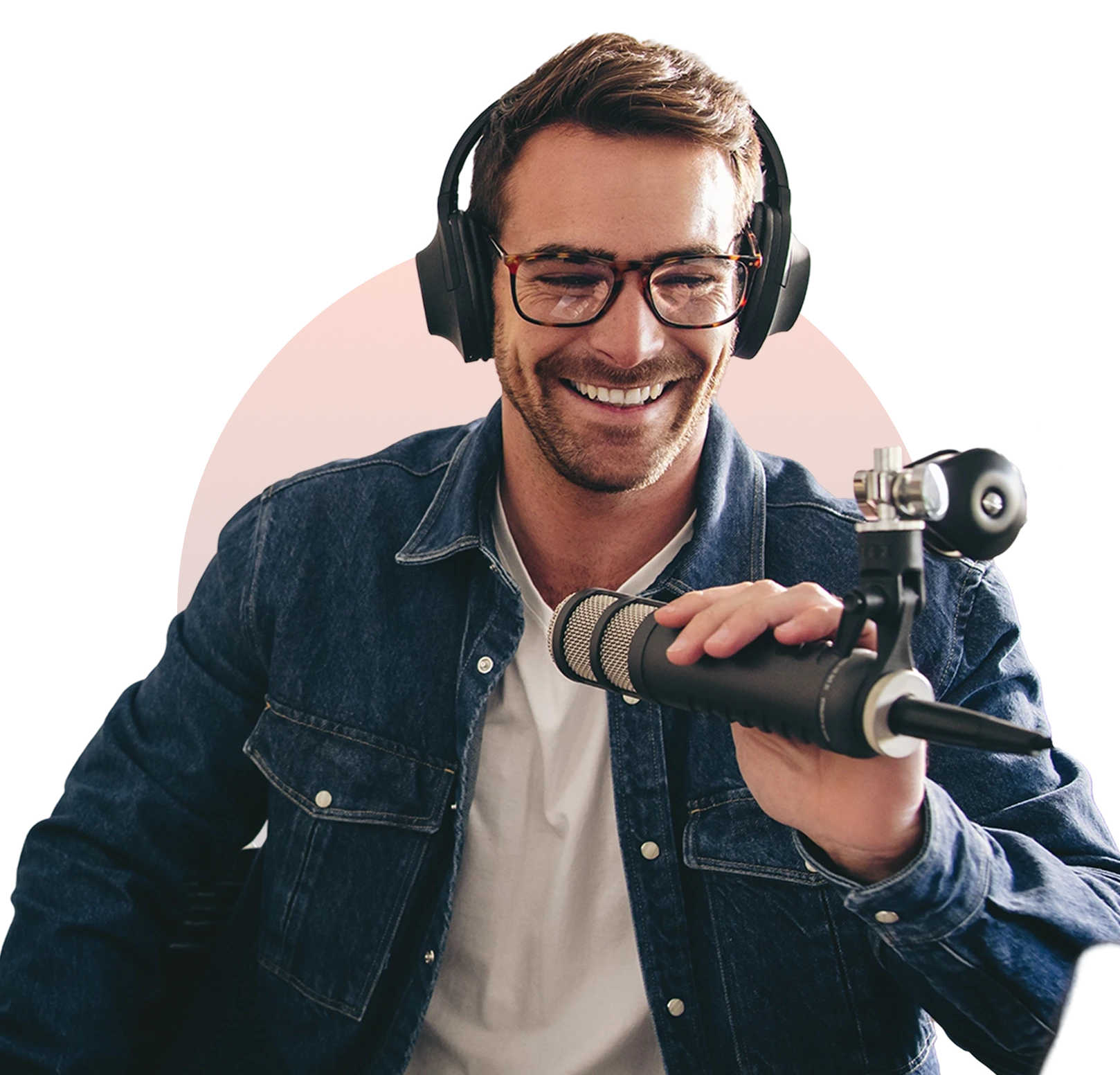 A man with headphones holding a video camera.