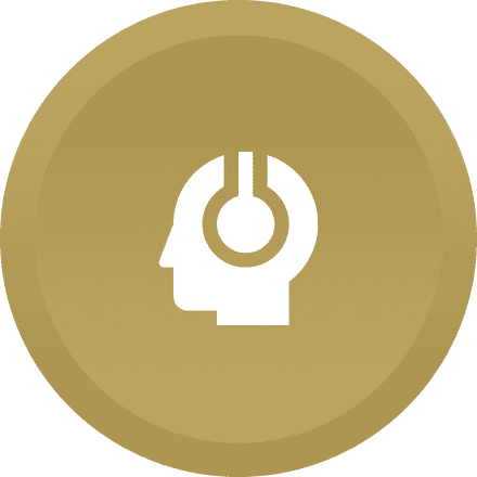 A gold colored button with a person 's head in the middle of it.